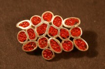 red cellular brooch